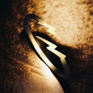 Stainless steel minimalist lightening bolt ring. Gold, adjustable.
