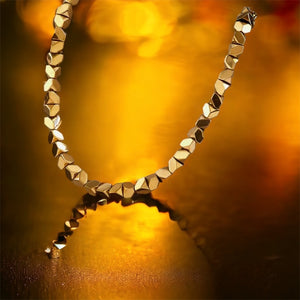 Stainless steel geometric pebbles necklace. Gold, waterproof.