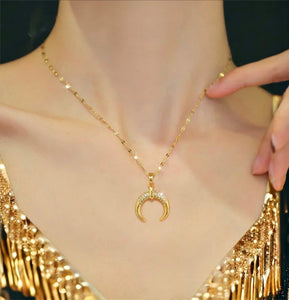 Stainless steel crystal crescent necklace. Gold, waterproof.