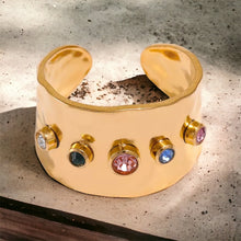 Stainless steel rainbow CZ cuff ring. Gold, adjustable.