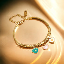 Stainless steel enamel hearts charm bracelet. Gold, adjustable.