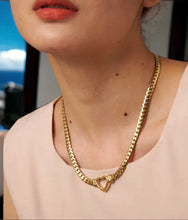 Stainless steel open heart curb necklace. Gold
