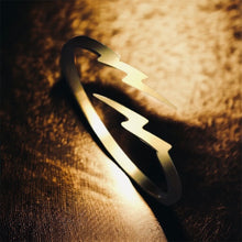 Stainless steel minimalist lightening bolt ring. Gold, adjustable.