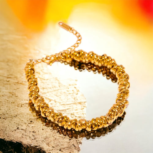 Stainless steel multi ring bracelet. Gold or tri colour.