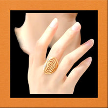 Stainless steel swirl ring. Gold,adjustable.
