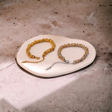 Stainless steel multi ring bracelet. Gold or tri colour.