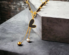 Stainless steel black heart charm necklace. Gold.