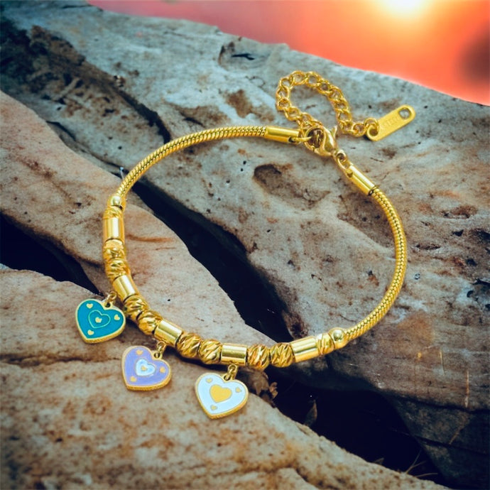 Stainless steel enamel hearts charm bracelet. Gold, adjustable.