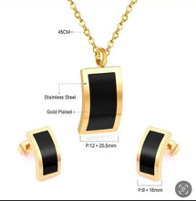 Stainless steel contemporary curved rectangle necklace set. Gold, black .