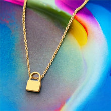 Stainless steel minimalist tiny 1cm lock necklace. Gold, waterproof.